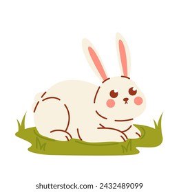 Easter bunny on lawn isolated on white background. Cute rabbit sits on grass. 