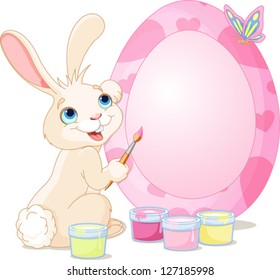Easter Bunny painting Easter Egg. Perfect for your Easter Greeting