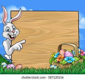 Easter bunny peeking around a background sign and pointing with a basket of Easter eggs in the foreground
