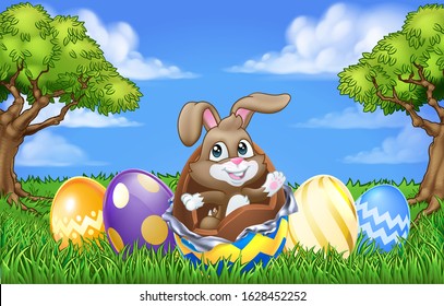 The Easter bunny rabbit breaking out of a chocolate Easter egg in an outdoor scene
