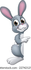 An Easter bunny rabbit cartoon character peeking around a sign