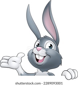 An Easter bunny rabbit cartoon character peeking around a sign