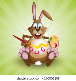 Easter bunny rabbit decorating his egg-like belly