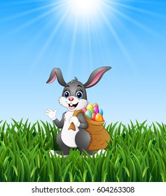 Easter bunny rabbit with easter eggs a sack of full in the grass background.Vector illustration