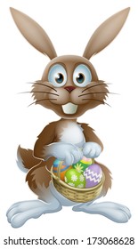 An Easter bunny rabbit holding a basket of decorated painted chocolate Easter eggs