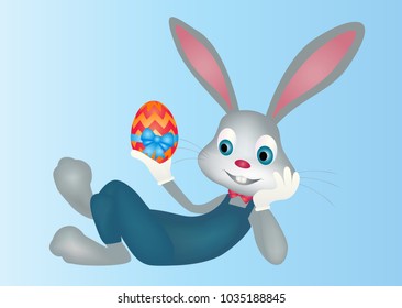Easter bunny rabbit lying across with egg