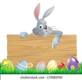 An Easter bunny rabbit wooden sign with painted chocolate Easter eggs