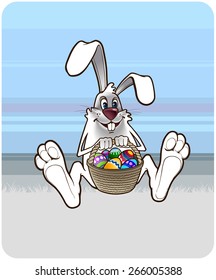 Easter Bunny sitting with a basket full of colored easter eggs 