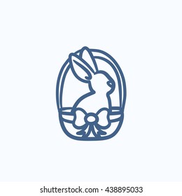 Easter bunny sitting in basket vector sketch icon isolated on background. Hand drawn Easter bunny sitting in basket icon. Easter bunny sitting in basket sketch icon for infographic, website or app.