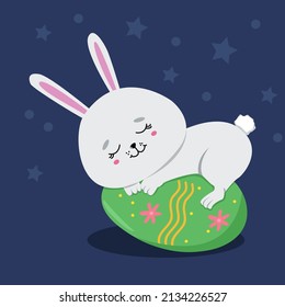 Easter bunny sleeping on egg
