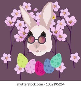 Easter bunny in sunglasses, Easter eggs and pink flowers on a brown background
