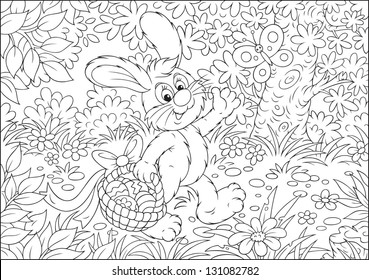Easter Bunny walking through the forest and carrying his basket with painted eggs