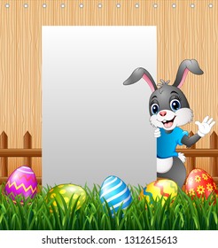 Easter bunny waving hand with blank sign