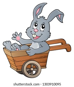 Easter bunny in wheelbarrow image 1 - eps10 vector illustration.