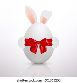 Easter bunny and a white egg with a red bow