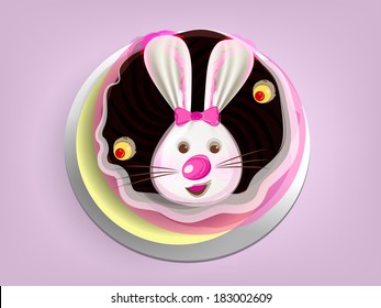 Easter cake with bunny face icing on purple background. 