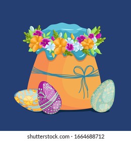 Easter cake decorated with a flower wreath with blue glaze on a white background.