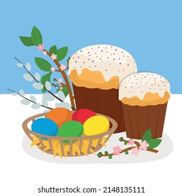 Easter cakes and Easter eggs on the table, willow twig