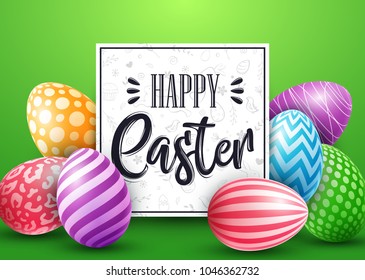 Easter card with colored decorated eggs on green background