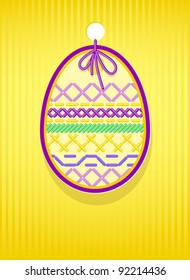 Easter card with egg and embroidery. Vector illustration.