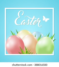 Easter card with eggs and green grass in white frame on a blue background