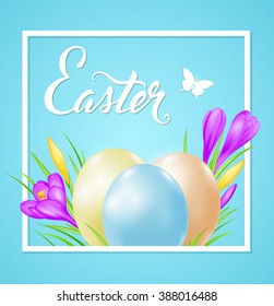 Easter card with eggs and violet crocuses in white frame on a blue background