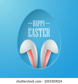 Easter card with paper egg shape frame with bunny ears in egg hole on green background