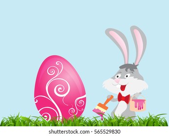 Easter card with a rabbit and egg on a green grass and a blue background