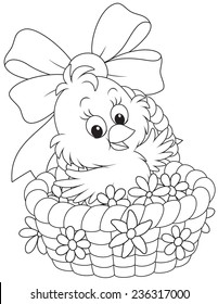 Easter Chick in a basket with flowers