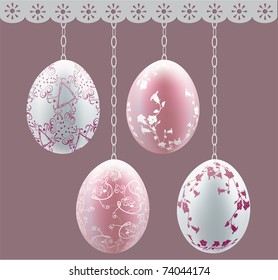 Easter colored eggs hanging on chains.
