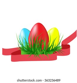 Easter colored eggs on the green grass