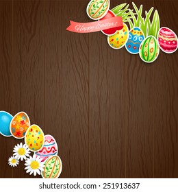 Huevos de Semana Santa sobre fondo de madera con espacio para copiar.