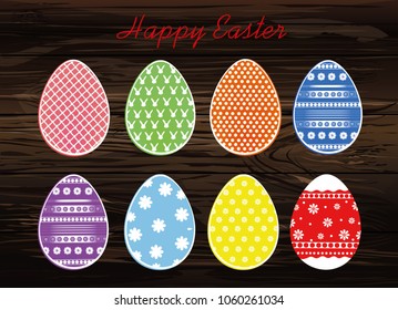 Easter colored  eggs with a pattern. Greeting card for the holiday. Free space for text. Vector on wooden background.