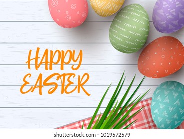 Easter colorful decorated eggs. Happy Easter. Festive white wooden background. Table cloth, herbs wisp, text,