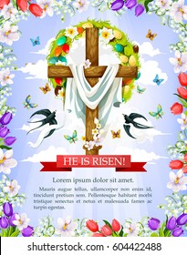 Easter cross greeting card wit floral frame. Crucifix with Easter wreath of egg and spring flower, flying butterfly and swallow bird with He Is Risen ribbon banner on blue sky background