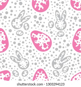 Easter cute bunnies and pink eggs, a seamless pattern on the white background. Minimalistic dotted textile design. Vector drawing repeat pattern of rabbits and eggs. Endless wallpaper style design.