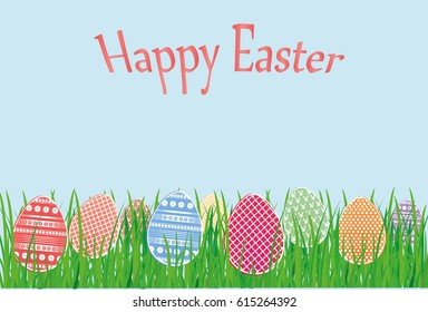 Easter decorative colorful eggs in the grass. Greeting card for the holiday. Free space for text.
