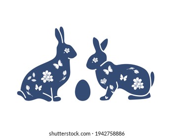 Easter egg beautiful design with dark blue rabbits and spring flowers 