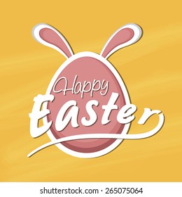 Easter egg with bunny ears on yellow background.