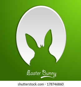 Easter egg cutout on green background.