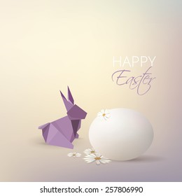 Easter egg, daisy flowers and purple origami rabbit decoration isolated on soft subtle blurry background 