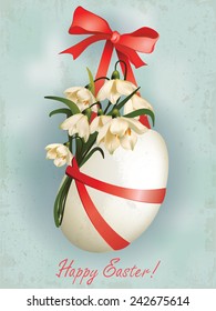 Easter egg with flowers and ribbons