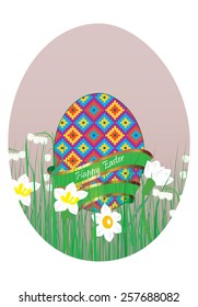 Easter egg in the grass and flowers