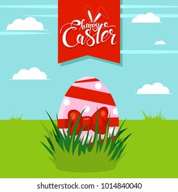 Easter egg in green grass on a background of blue sky with clouds. Vector cartoon greeting card with handwritten text.