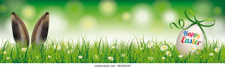 Easter egg with green ribbon in the grass with rabbit ears. Eps 10 vector file.