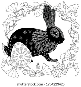 Easter egg hunt in flowers. Little bunny collecting painted eggs 
among flowers, a black and white vector illustration for a coloring book. Art therapy coloring page.