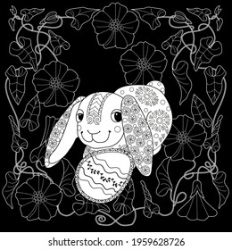 Easter egg hunt in flowers. Little bunny collecting painted eggs 
among flowers, a black and white vector illustration for a coloring book. Art therapy coloring page.