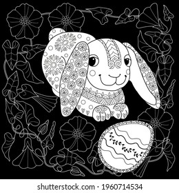 Easter egg hunt in flowers. Little bunny collecting painted eggs 
among flowers, a black and white vector illustration for a coloring book. Art therapy coloring page.