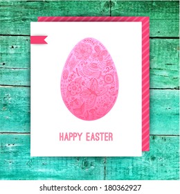 Easter egg made of flowers, floral Easter egg background. Happy Easter card on wood surface texture. Happy easter cards illustration with easter egg
