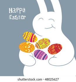 Easter egg in rabbit armful on the cool gray background.